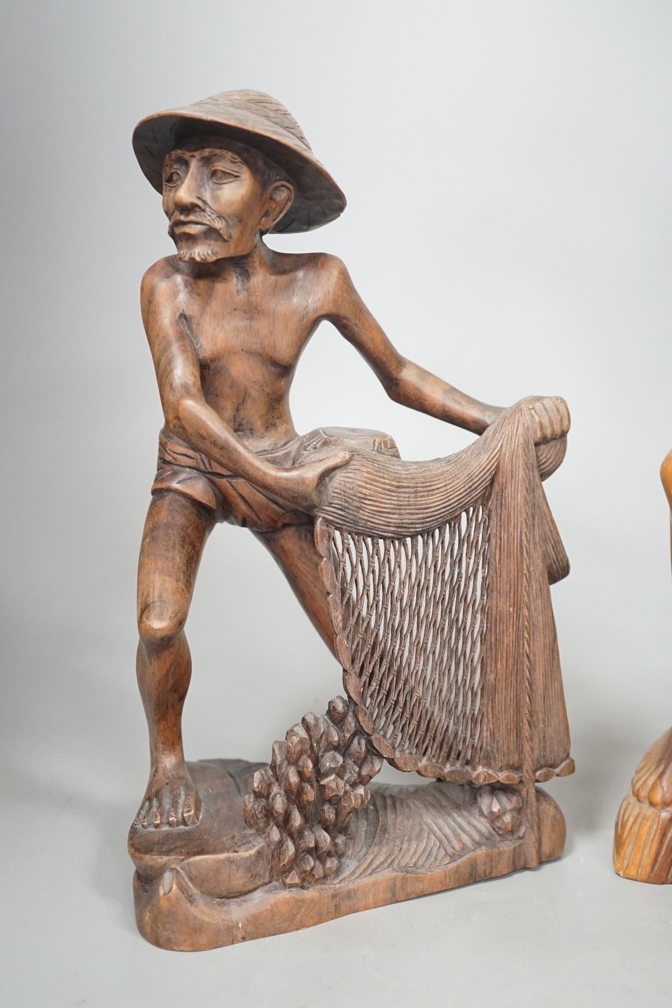 Two southeast Asian figural hardwood carvings 35cm
